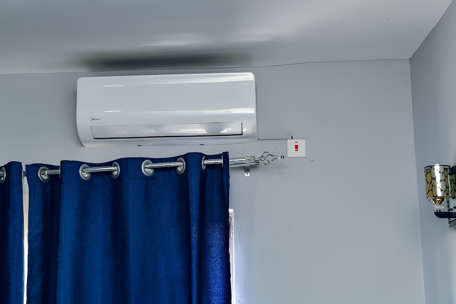 Air conditioning and curtains in a guest room